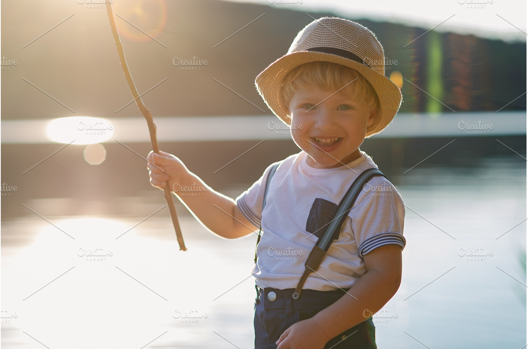 A small toddler boy standing by a, a Person Photo by HalfPoint