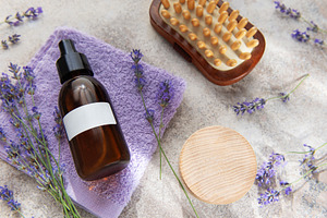 Lavender essential oil with spa massage accessories, a Health & Medical Photo by Olena Rudo