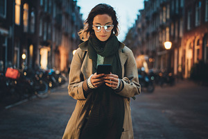 Stylish woman walking in the city 