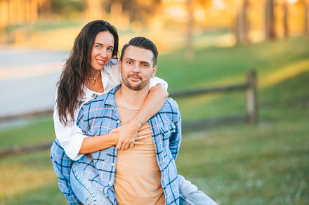 Couple on vacation in the park having fun outdoors, a Person Photo by travnikovstudio