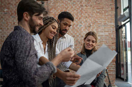Cheerful young businesspeople, a Person Photo by HalfPoint