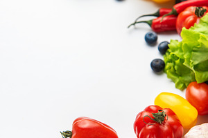 Fresh organic vegetables and fruit border on white, a Food & Drink Photo by Olena Rudo