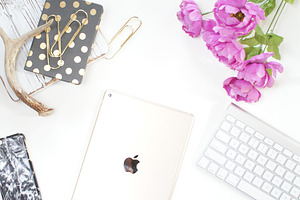 Tech with gold & flowers desk photo stock photo containing styled stock