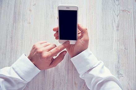 Man's hands using smartphone stock photo containing smartphone and phone