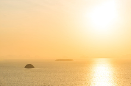 Many small islands on sunset sea, a Nature Photo by Vapi