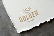 Gold Debossed Paper Logo Mockup, a Mockup by Design Squad (Thumbnail 1 of 4)