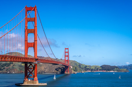Golden Gate Bridge over blue waters with scenic hills in San Fra, an Architecture Photo by GoodGoods