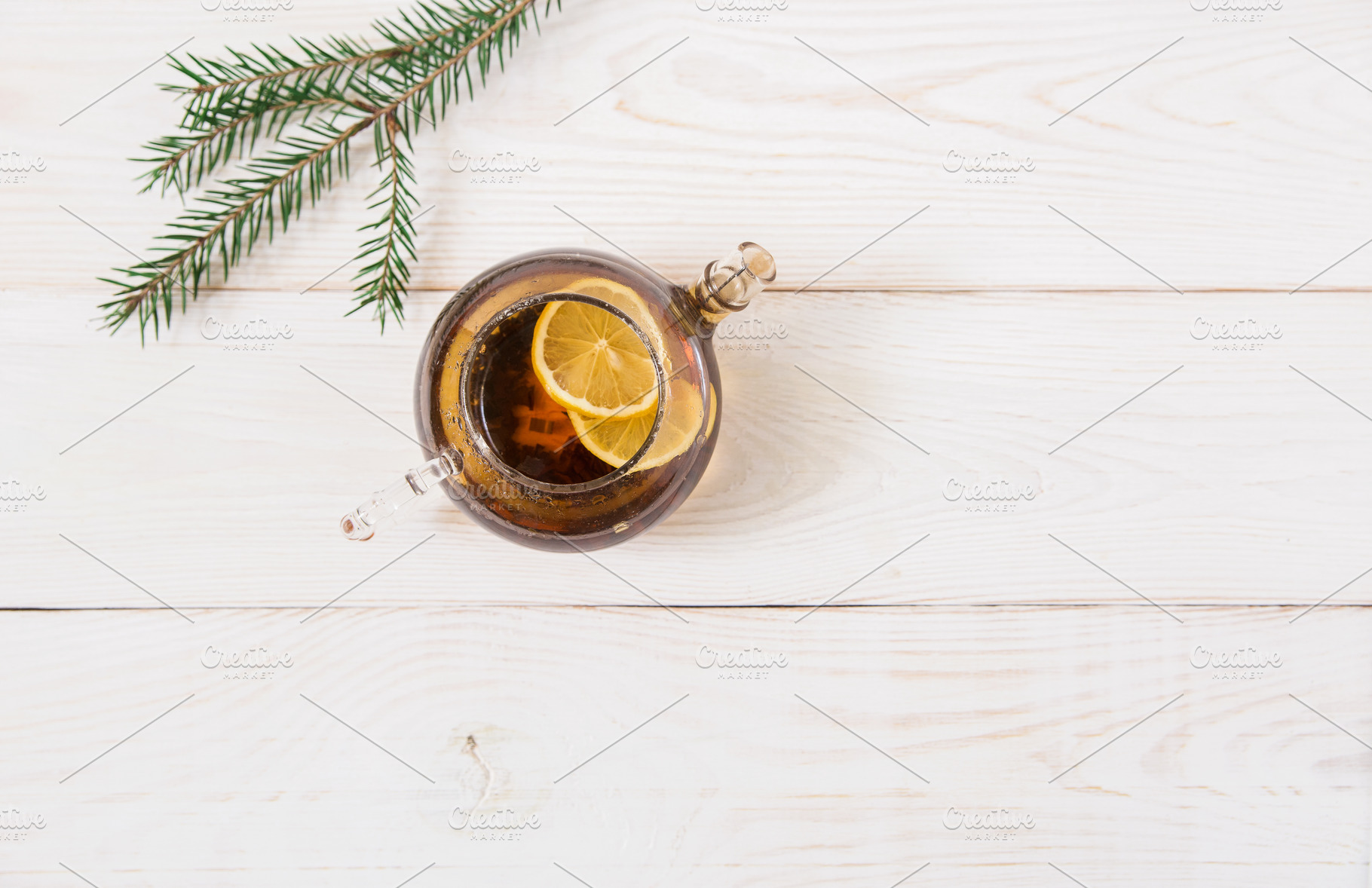 Teapot with black tea and lemon, a Food & Drink Photo by Kolomiyets Viktoriya