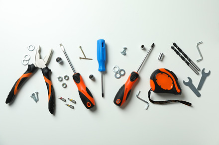 Work tools on white background, top view, an Industrial Photo by AtlasStudio PRO