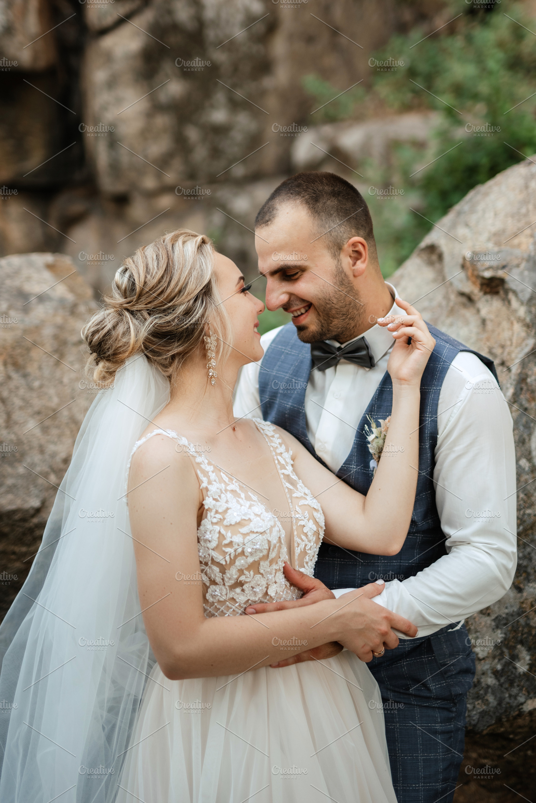 the groom and the bride are walking in the forest, a Person Photo by Weddings, People, Travel