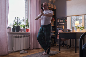 Senior man working out, yoga in