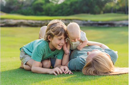 Mother, older son, and newborn baby