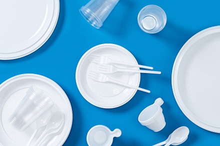 Disposable waste plastic on blue background., an Industrial Photo by etorres69
