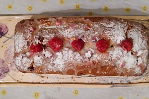 Cake with a golden-brown crust, topped with powdered sugar and r, a Food & Drink Photo by DanFLCreativo