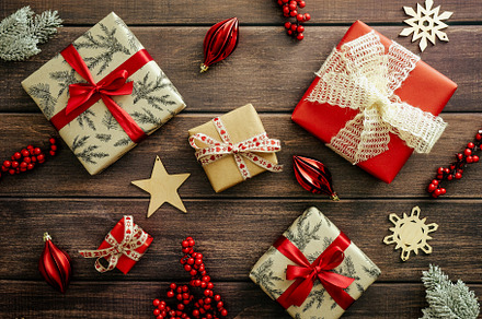 Vintage Christmas composition. Christmas gifts and red baubles on wooden plank, a Holiday Photo by photoguns