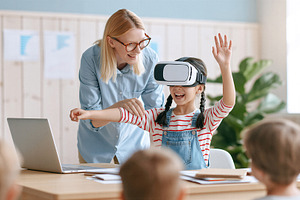 Girl using virtual reality headset, a School & Education Photo by 7DesignLab