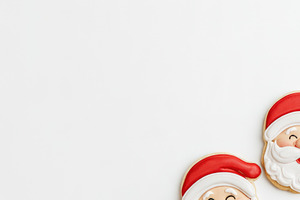 Santa Claus Christmas cookies with stars and gifts on white back, a Food & Drink Photo by José Manuel Gelpi
