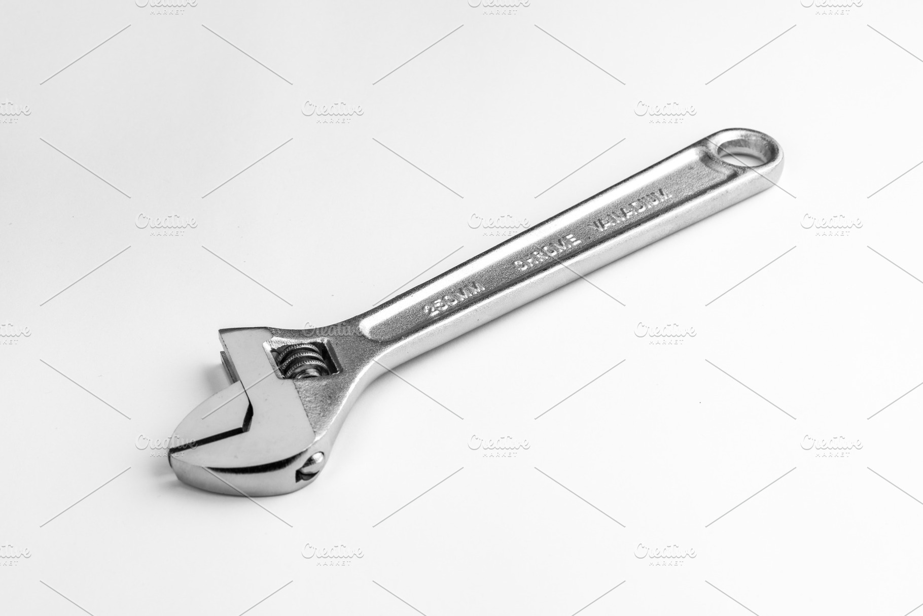 Adjustable wrench isolated photo, an Industrial Photo by FineArtStudio