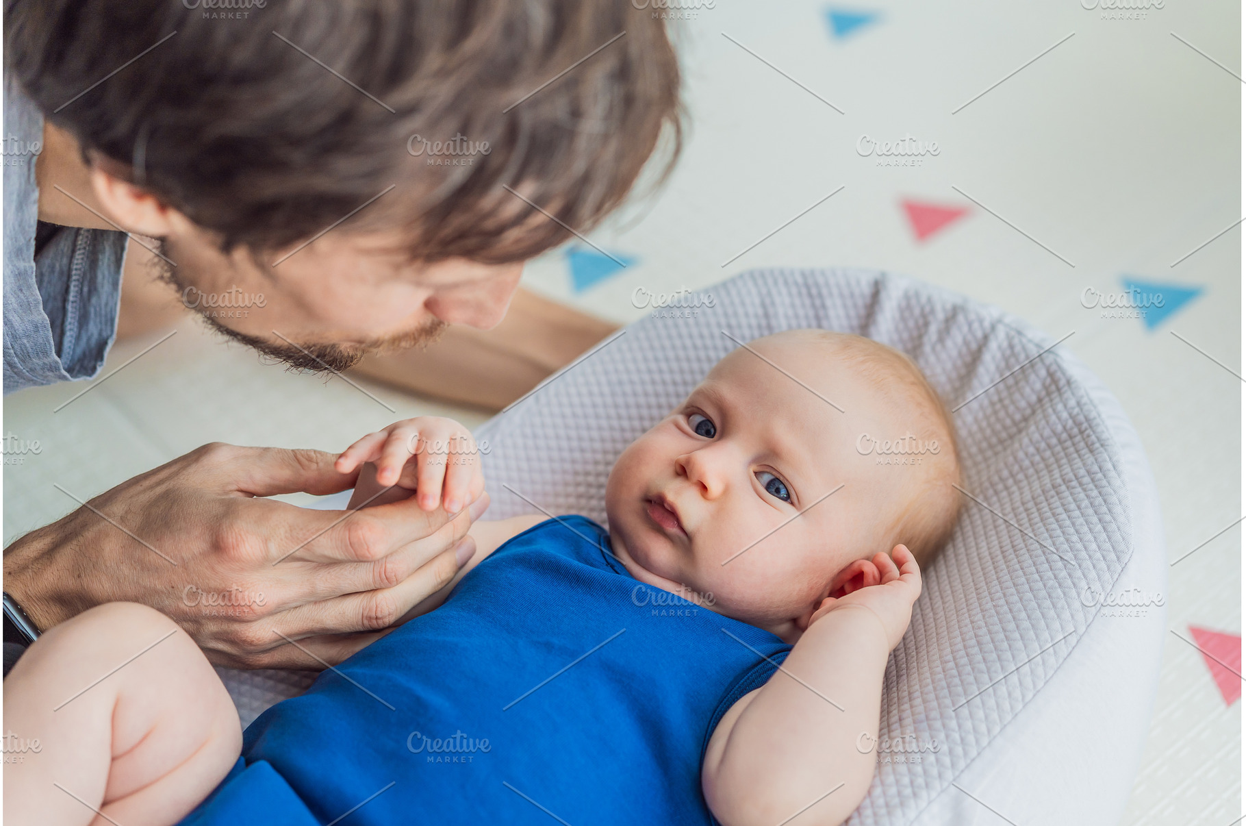 Loving father interacts with his 3, a Person Photo by Elizaveta Galitskaya