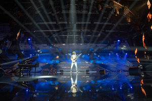 artist on stage in a beam of light, a Photo by Pictures for you!!!!!!!!!