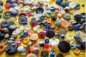 Colorful sewing buttons on bright, a Background Photo by Gladkov photography