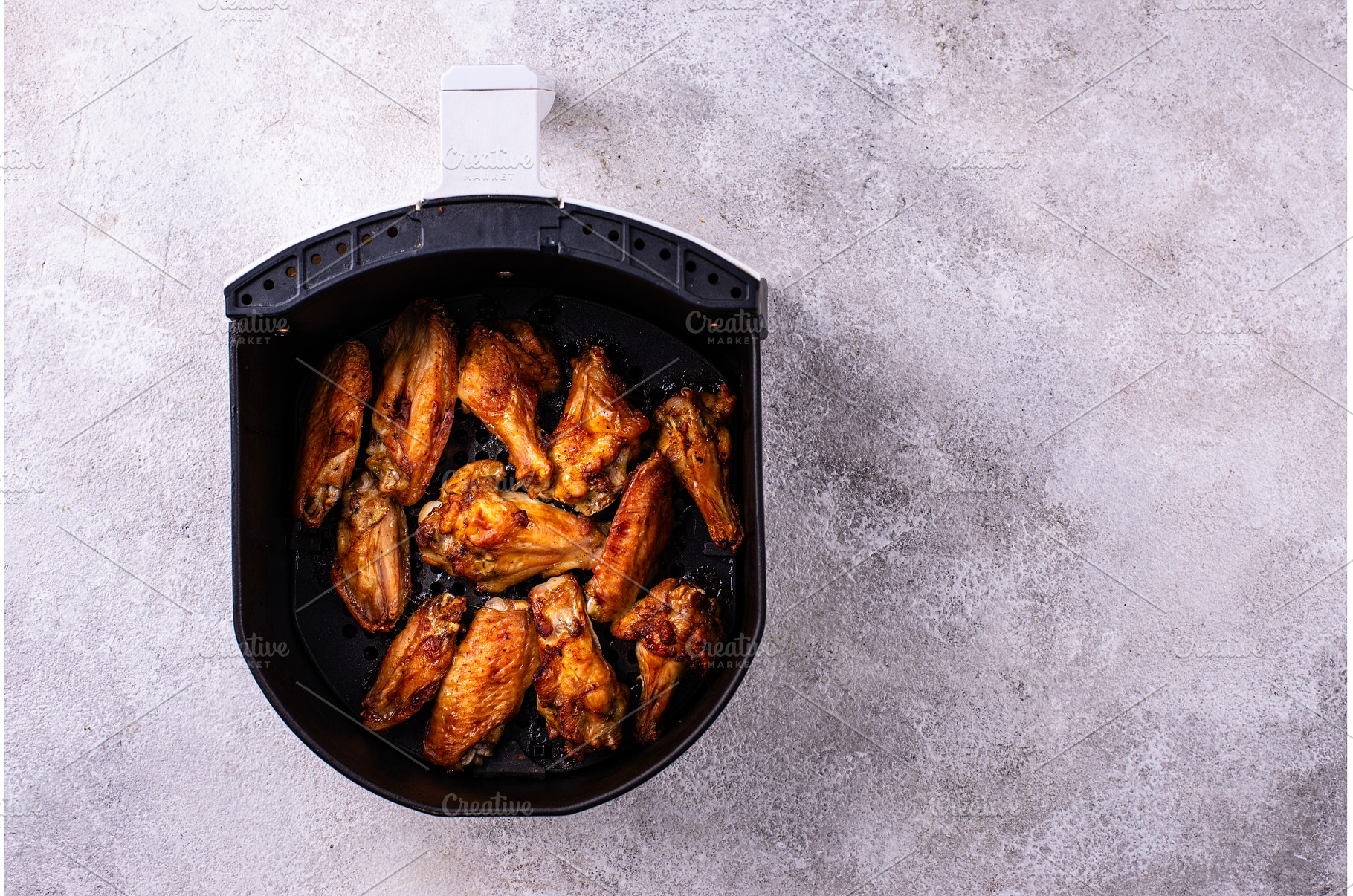 Chicken wings roasted in air fryer, a Food & Drink Photo by Yulia Furman
