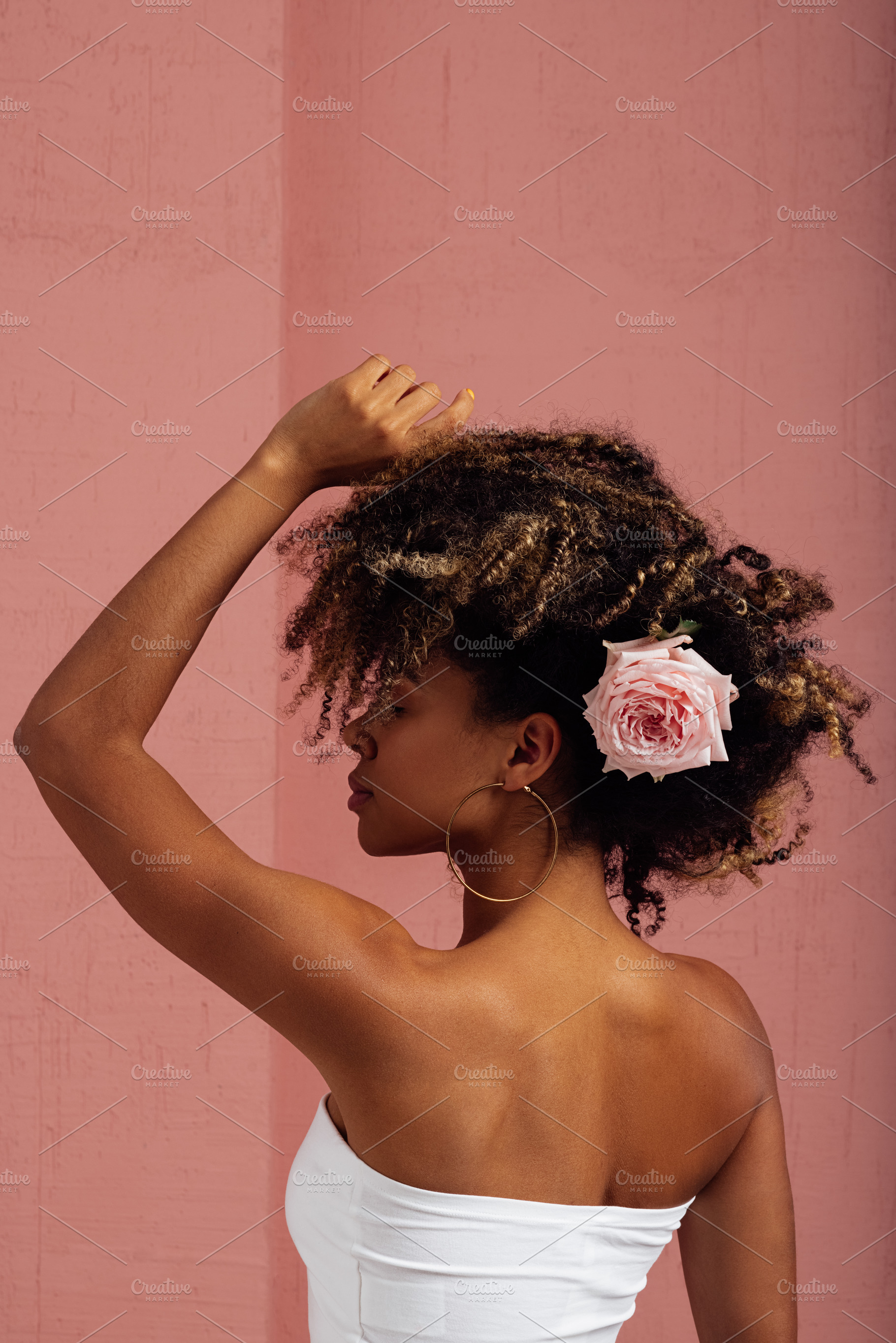 Woman with flower in her hair posing, a Person Photo by Artem Varnitsin