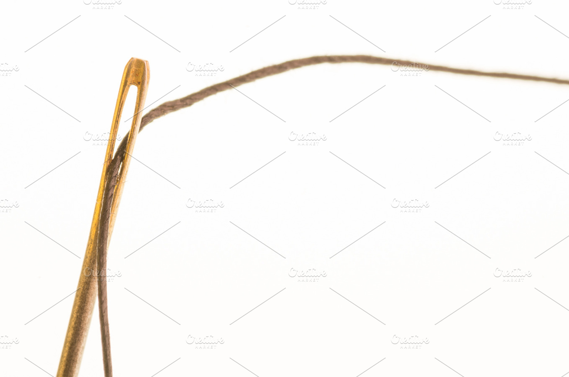 Metal sewing needle with thread