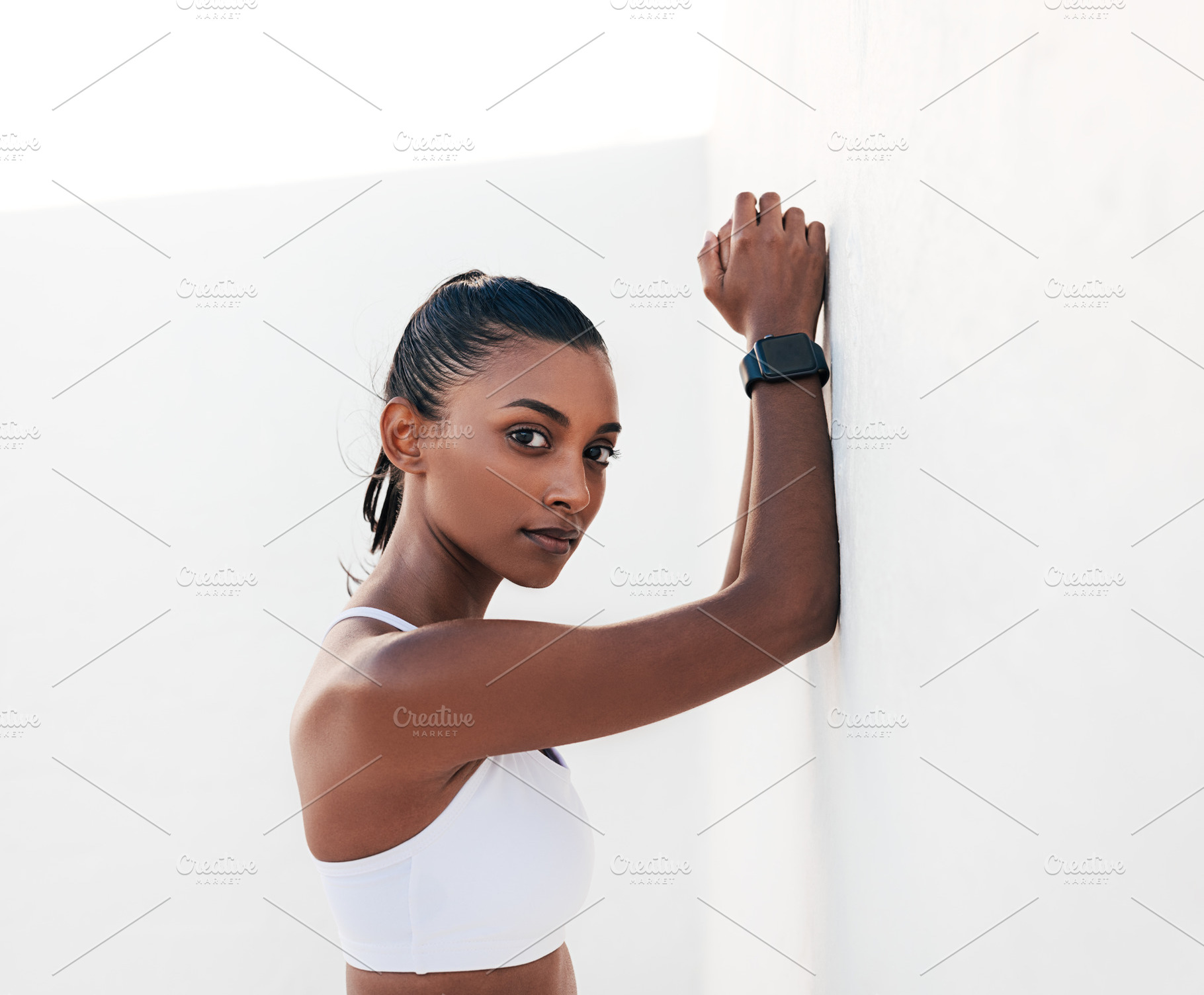 Slim athlete leaning white wall, a Sports & Recreation Photo by Artem Varnitsin