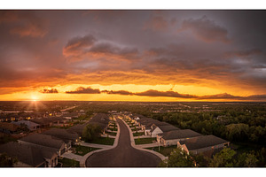 Dramatic storm clouds lit by setting, an Architecture Photo by Backyard Stock