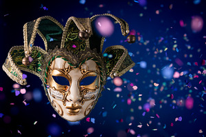Venetian carnival mask among flying