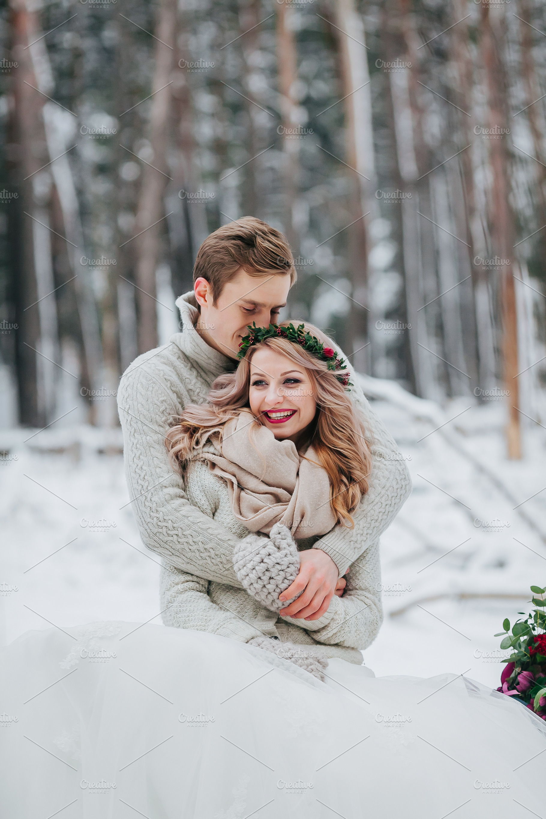 Happy newlyweds are hugging in the winter forest couple in love winter, a Person Photo by Stahov