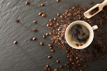 Hot coffee with foam and roasted beans around  top, a Food & Drink Photo by Davizro's Market