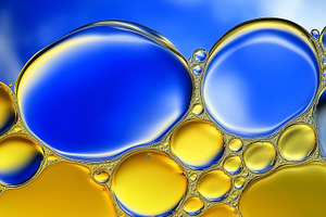 Large blue and yellow bubbles, an Abstract Photo by Imaginarium