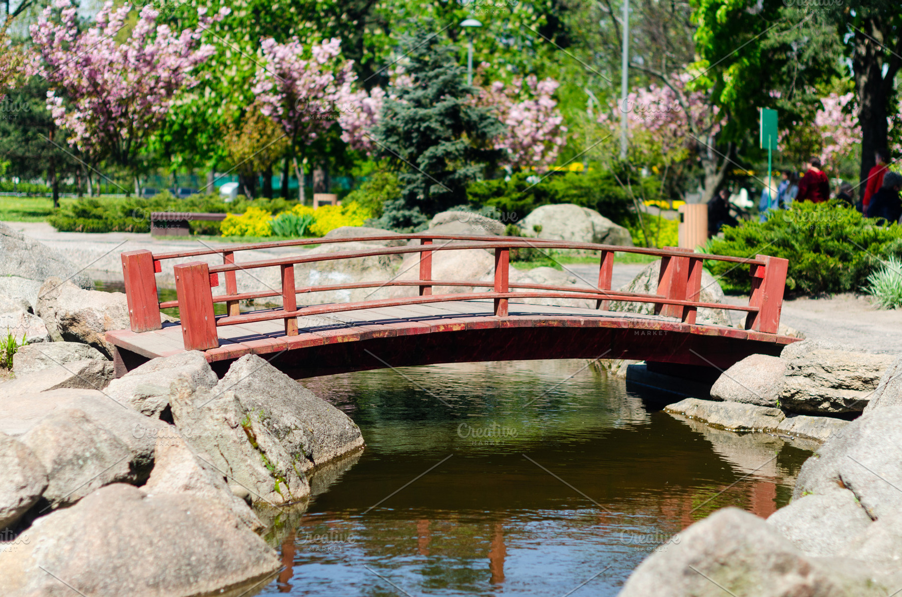 Small Red Wooden Bridge Over Pond in Japanese Garden, a Nature Photo by vimart