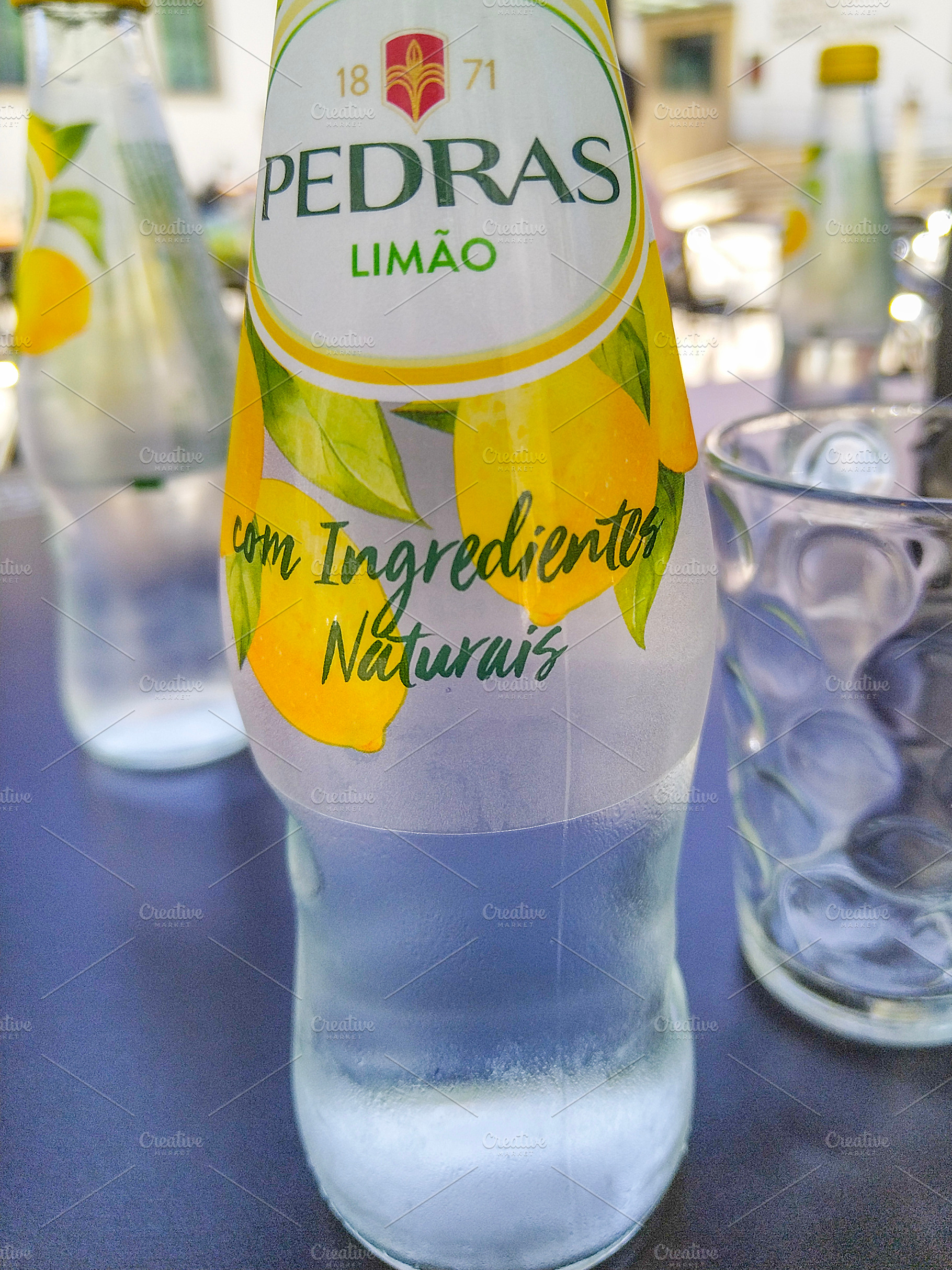 Pedras limao bottle on a restaurant table, a Food & Drink Photo by DanFLCreativo