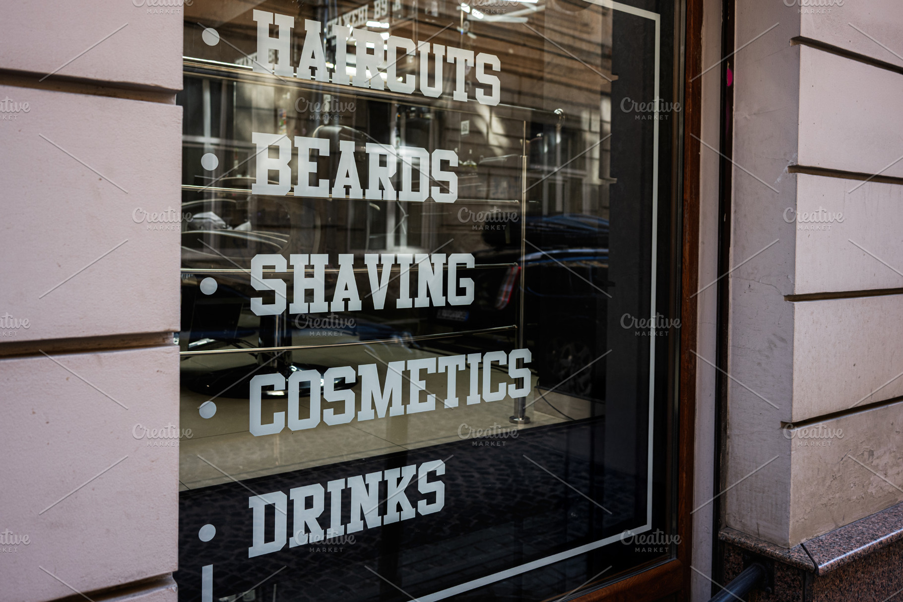 Barber shop window display showcasing services like haircuts, cosmetics, and dr, a Photo by AS photostudio