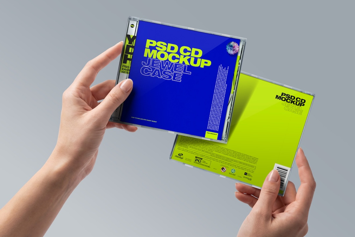 CD Jewel Case Mockup - Hands Holding, a Mockup by Avelina Studio (Photo 1 of 3)