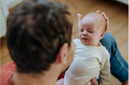 Close-up of father holding his, a Person Photo by HalfPoint