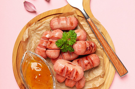 Concept of tasty food, grilled mini sausage, top view, a Background Photo by AtlasStudio PRO