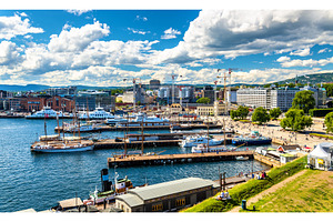 Oslo harbour with boats and yachts near the City Hall Square, an Architecture Photo by Leonid Andronov