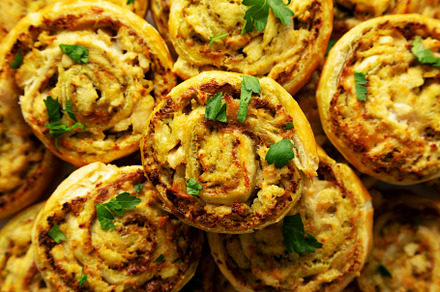 Homemade Chicken Pesto Pinwheels on a Plate, top view. Flat lay,, a Food & Drink Photo by LiudmylaChuhunova
