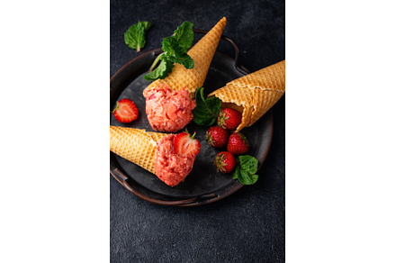 Strawberry ice cream in waffle cone, a Food & Drink Photo by Yulia Furman