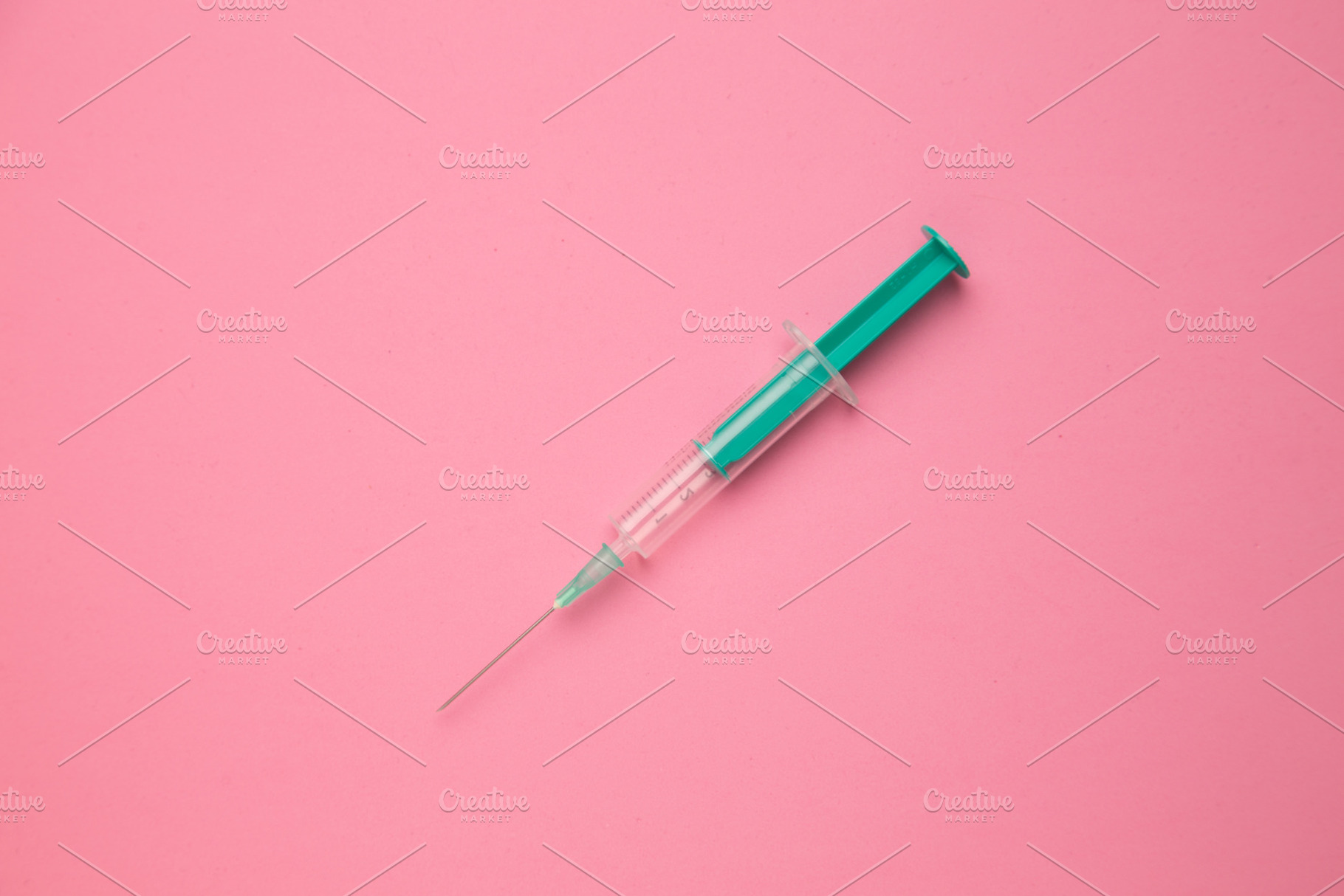 Medical syringe on colorful backgrou, a Background Photo by robcar