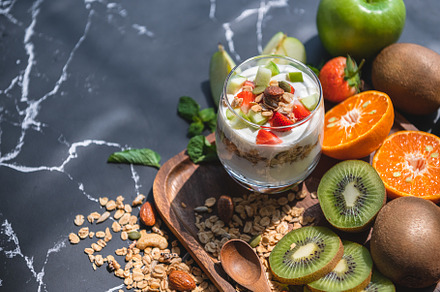 Closeup nutrition yogurt with many fruits on table. Food cuisine, a Food & Drink Photo by Ministocker