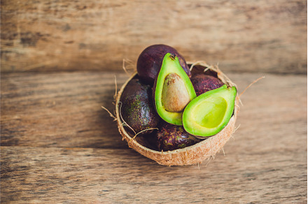Fresh organic avocado on dark old, a Food & Drink Photo by Elizaveta Galitskaya
