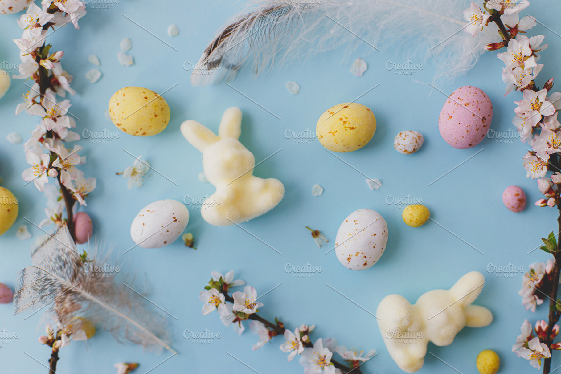 Happy Easter! Colorful Easter chocolate eggs, bunny, cherry blos, a Holiday Photo by Sonjachni