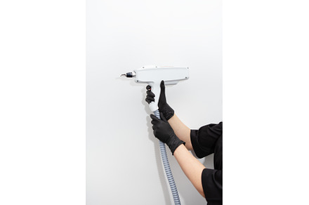 A laser epilation master holds a, a Beauty & Fashion Photo by Artsaba Family