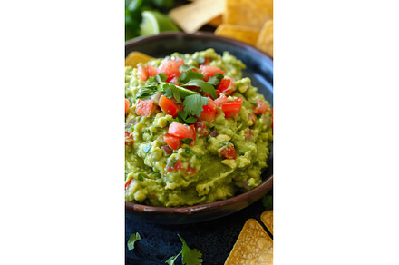 Guacamole dip in bowl garnished with, a Food & Drink Photo by Lermont51