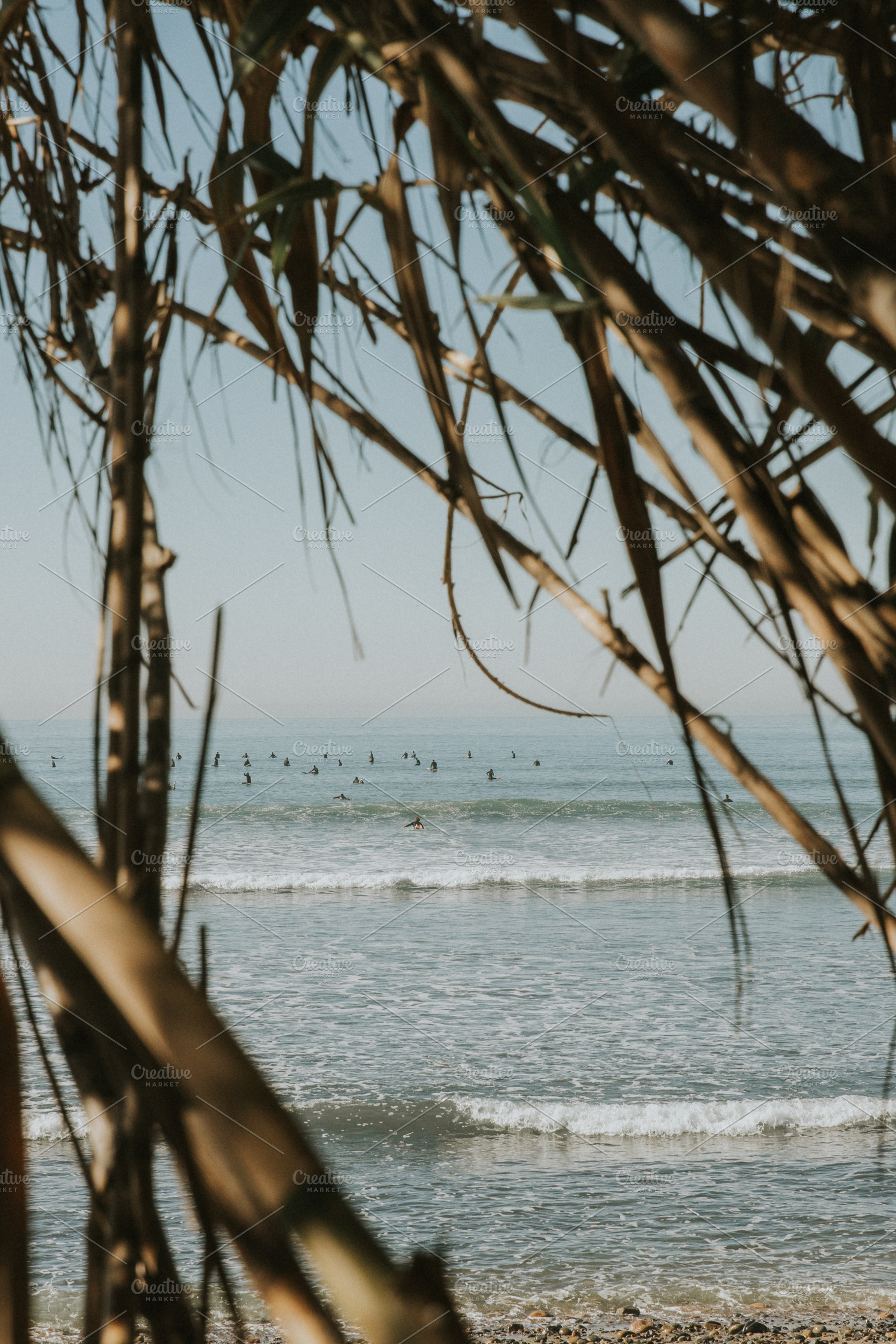 Surfers in the water, a Nature Photo by remi + tori